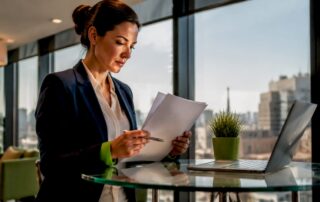 Businesswoman reviewing company registration documents