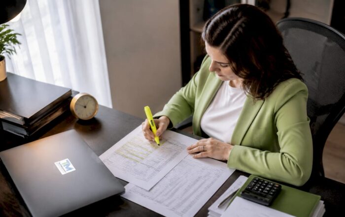 Employee reviewing payroll and social security documents