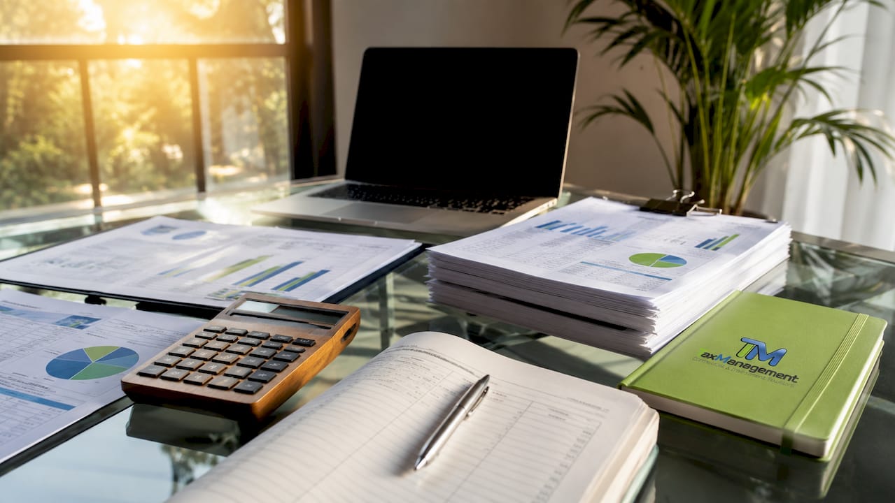 Accounting reports and company documents on desk