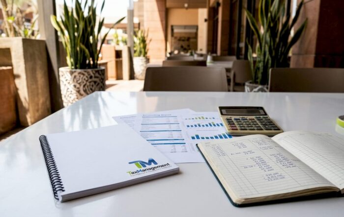 Accounting reports and calculator on office desk